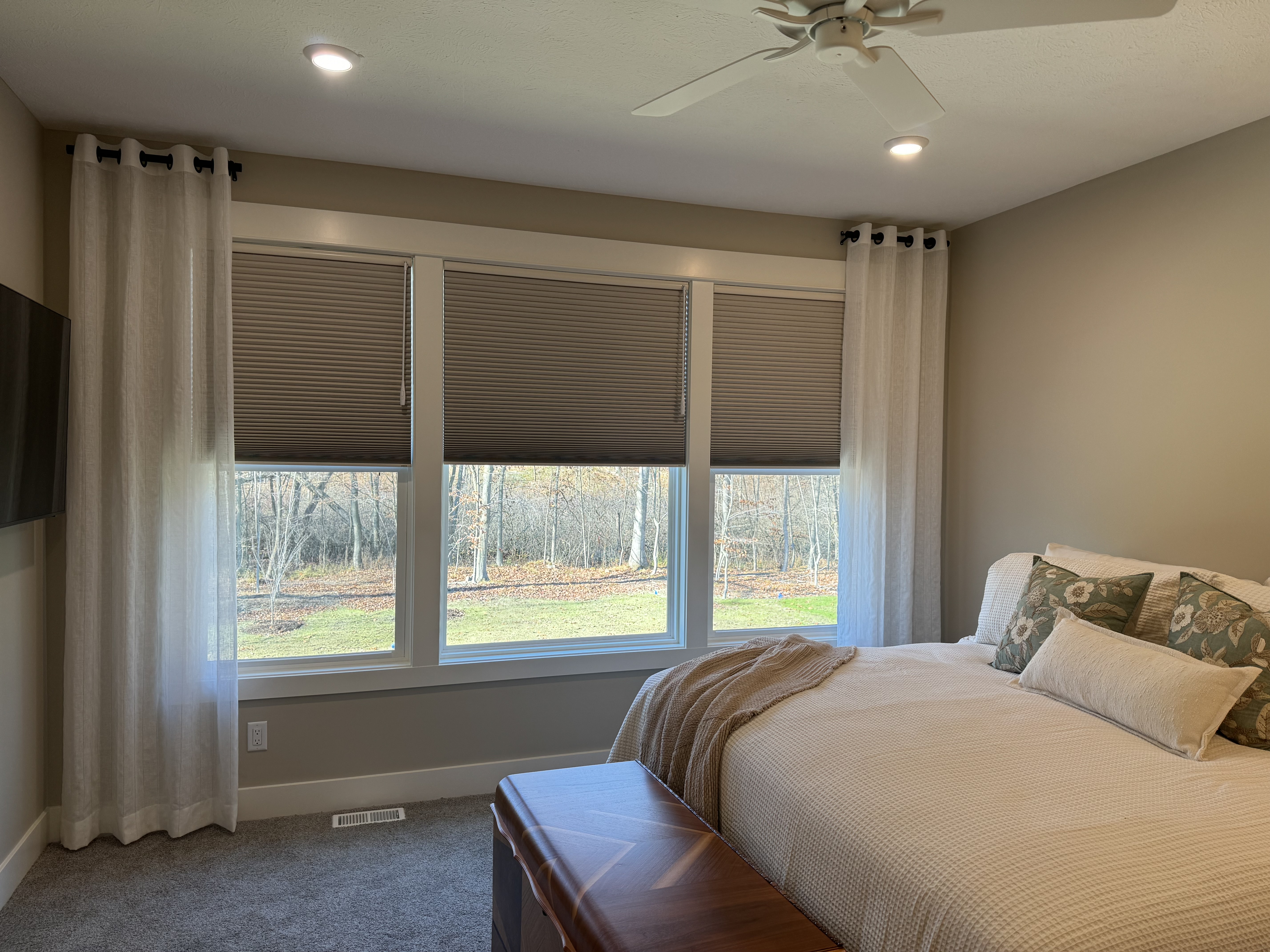 Motorized Blackout Shades with Power Wand paired with Sheer Decorative Panels and Decorative Hardware