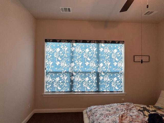 Bedroom with pattern, roller shade