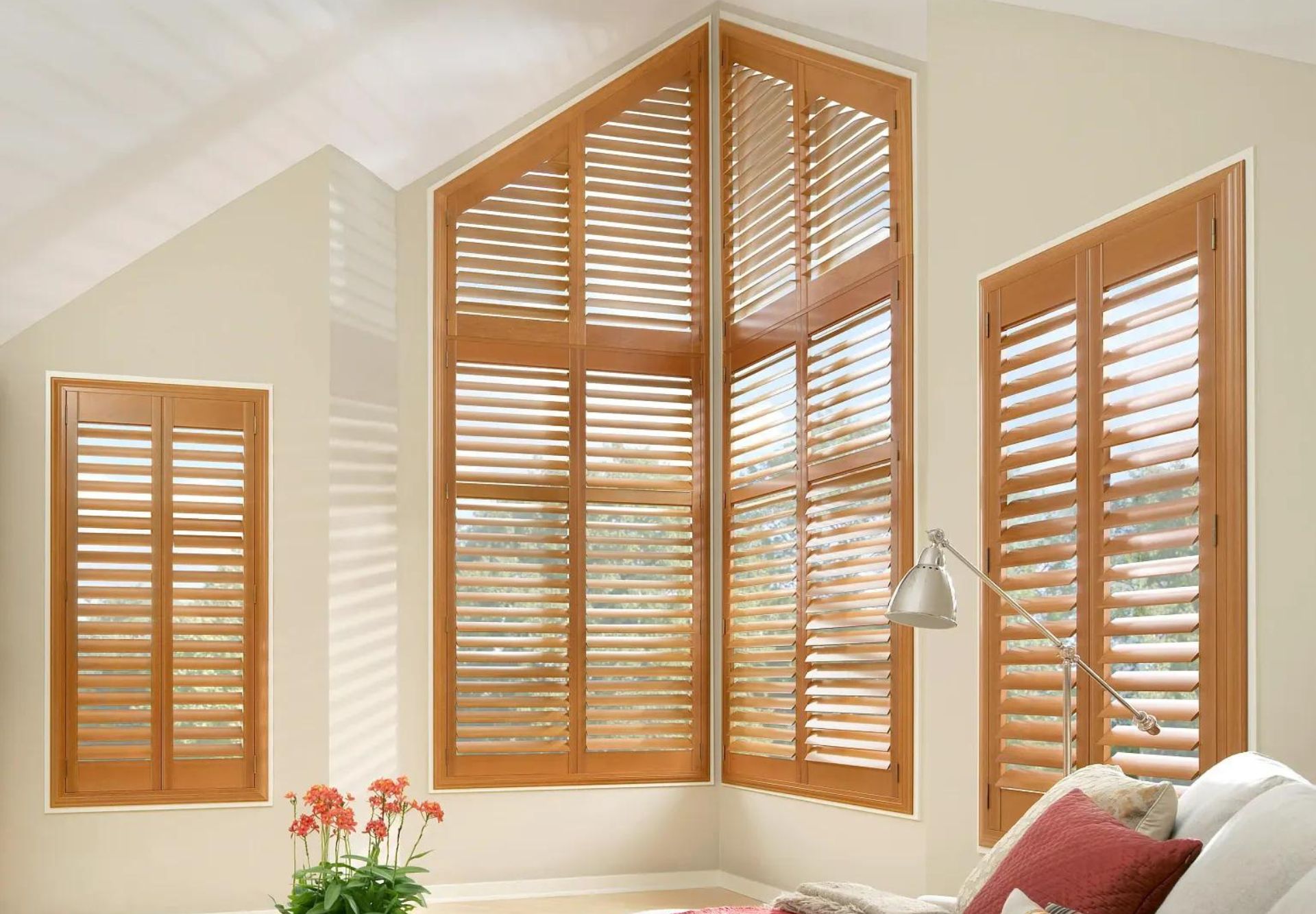 Sunlit Room with Custom Wood Plantation Shutters on Unique Window Shapes