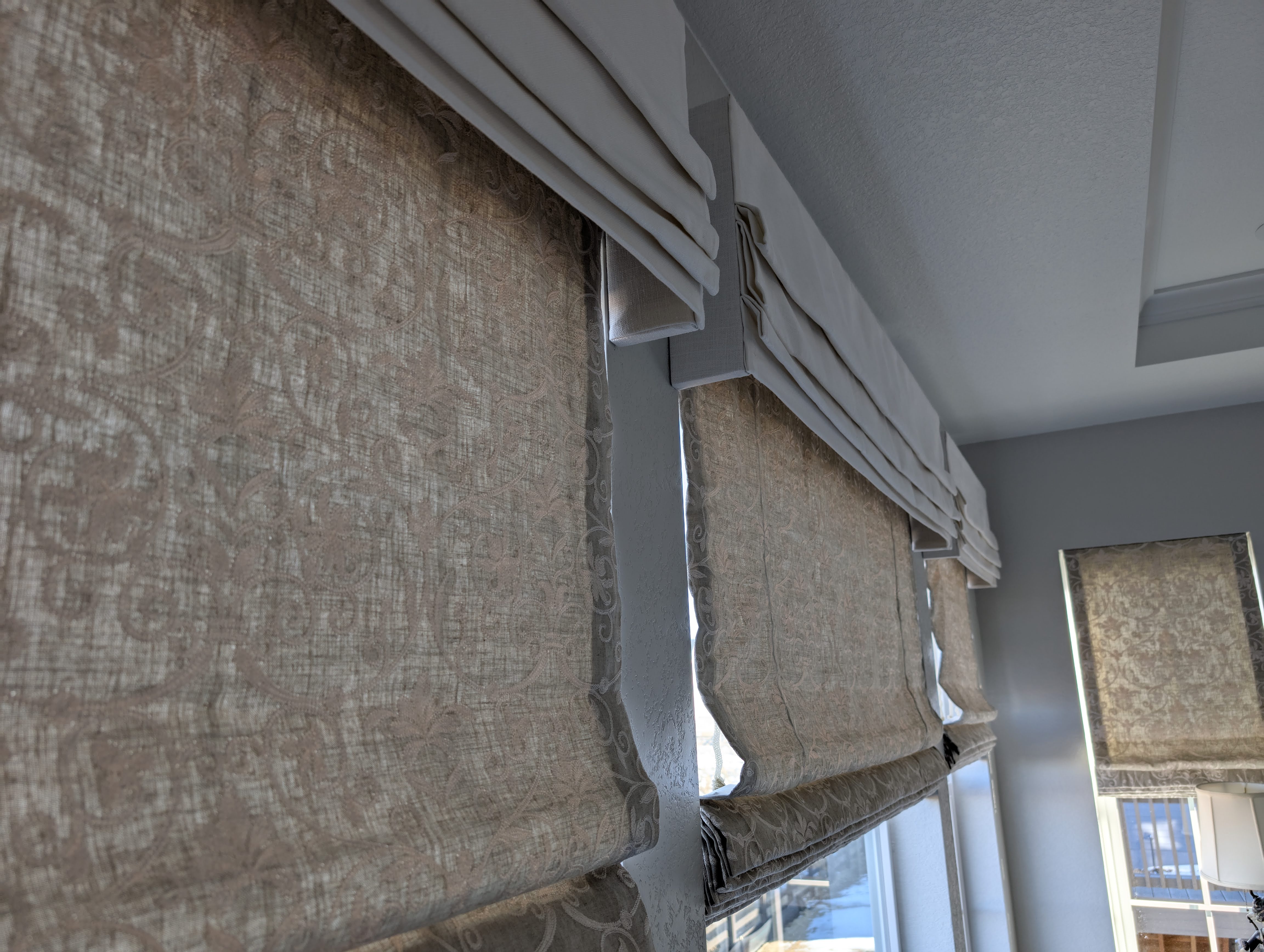 Roman Shades with premium top treatment